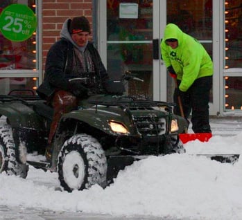 Schill team removing snow at a commercial property during winter in Ohio