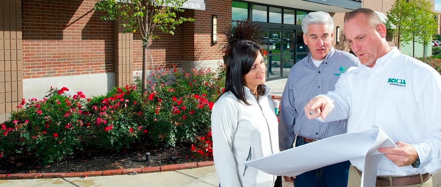 commercial landscape contractors discussing landscaping maintenance needs with a client