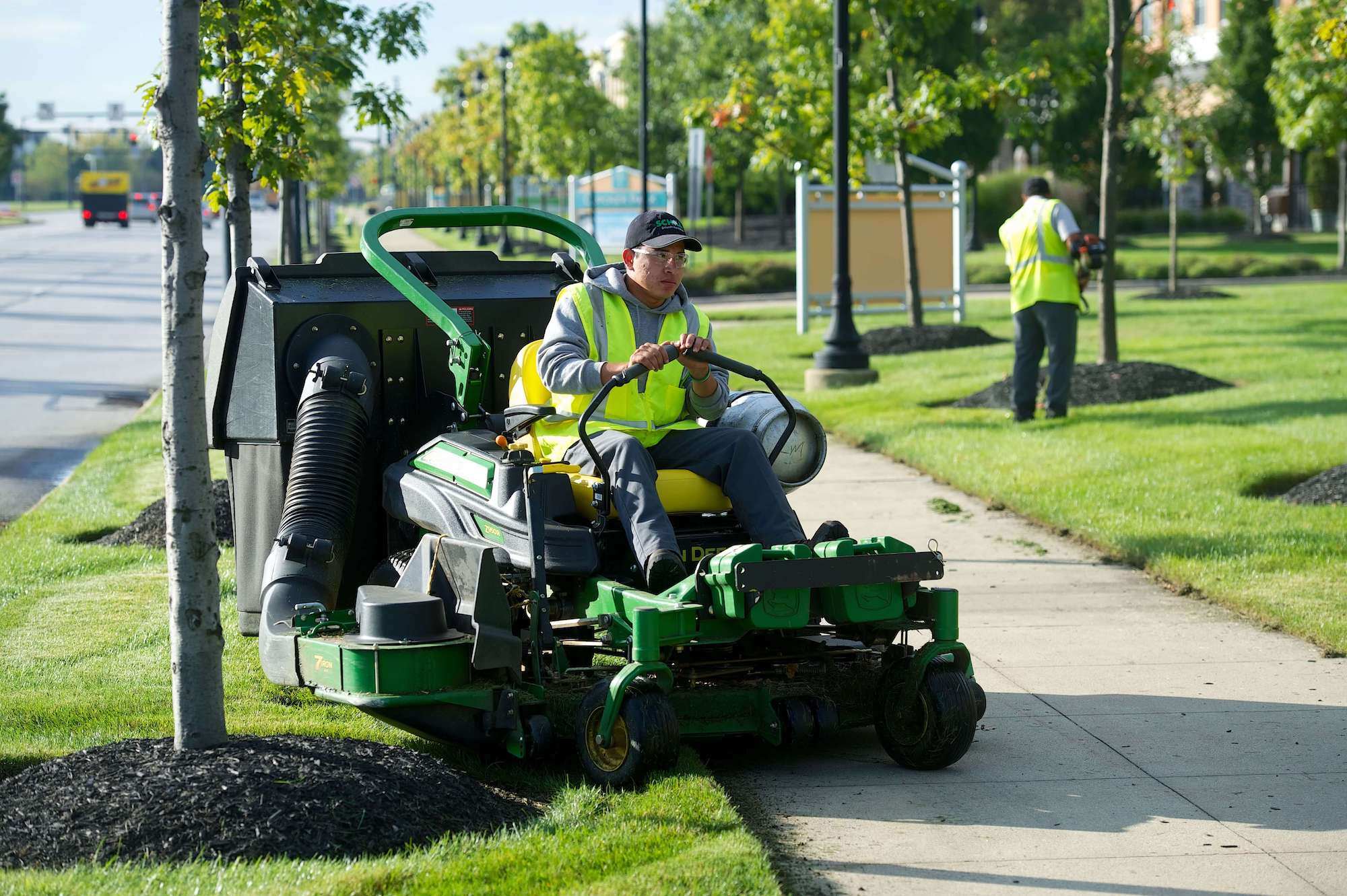 Schill commercial landscape worker mowing 