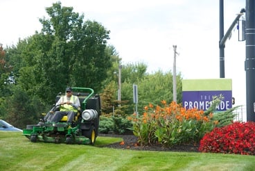 Schill Landscaping mowing lawn at commercial retail property