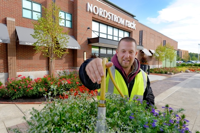 Schill Landscaper watering flowers at Crocker Park