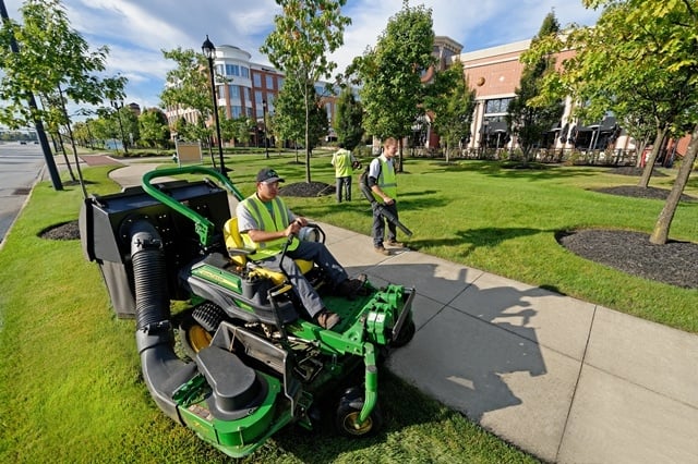 Schill commercial landscaping employees mowing lawn