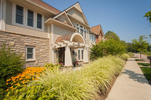 Apartment landscaping services completed along sidewalk